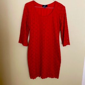 Women’s Red Dress with scalloped hem and sleeves.